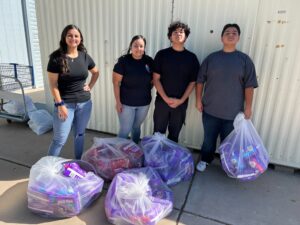 Elaine and her children donating five bags of diapers to Hope Women's Center in Arizona